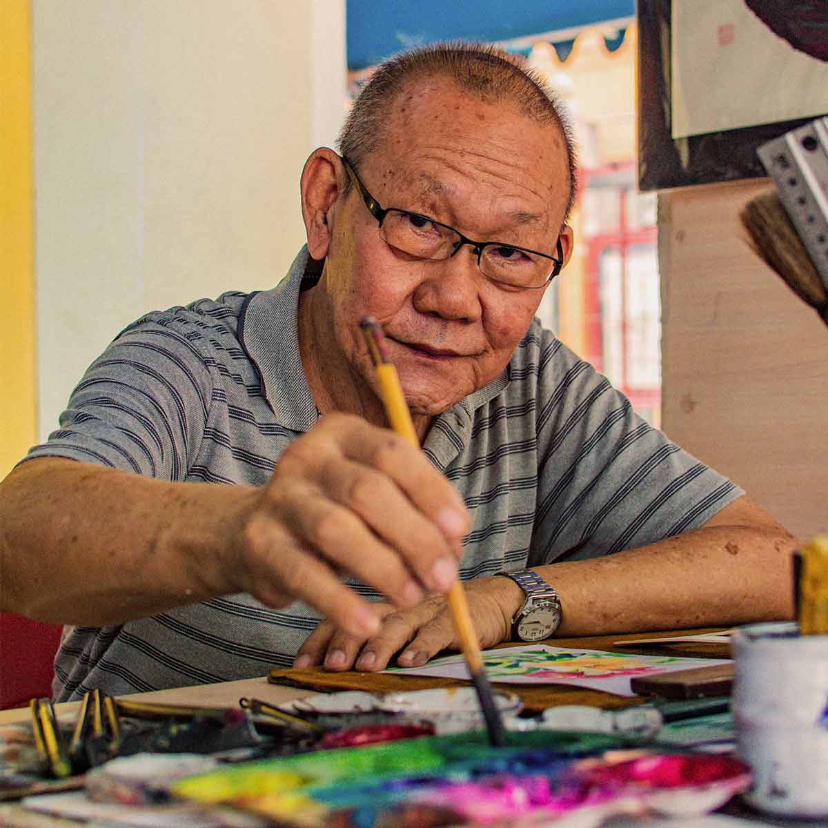 Older man painting